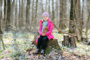 Little girl with a rabbit