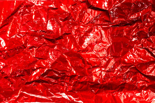 Red Glossy Texture Of Crumpled Metal