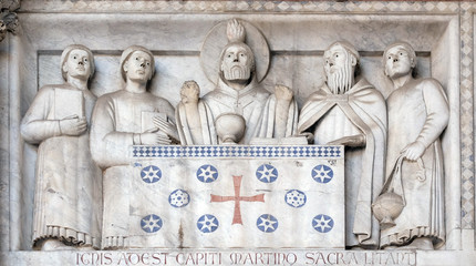 Detail of the bas-relief representing the Stories of St. Martin, Cathedral of St. Martin in Lucca, Italy