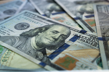 Pile of new one hundred dollar bills bills, close up dollars