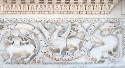 Bass relief on the Portal of San Michele in Foro Church in Lucca, Italy