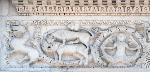 Bass relief on the Portal of San Michele in Foro Church in Lucca, Italy