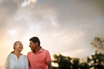 Mature couple lovingly looking at each other.