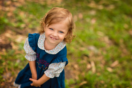 Portrait of cute toddler girl in her dress.