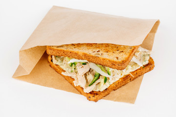 Tasty sandwich with slices of chiken, cheese and fresh organic vegetables