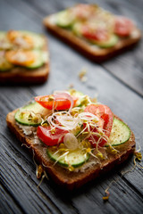Healthy vege toasts with onion, cucomber, cherry tomatoes