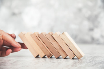 woman hand wooden cubes on table