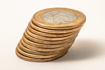 One real coins. Brazilian money. Selective focus. Brazilian currency. Economy, inflation, business. Front side. 1.