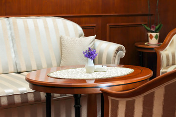 Hotel lobby and bar separe with sofa and oval table