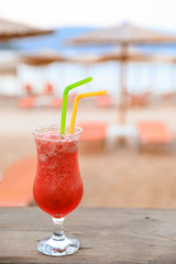 Strawberry cocktail. Evening relaxation with a glass of strawberry cocktail during the summer holidays in the Antisamos beach bar, Kefalonia island, Greece.