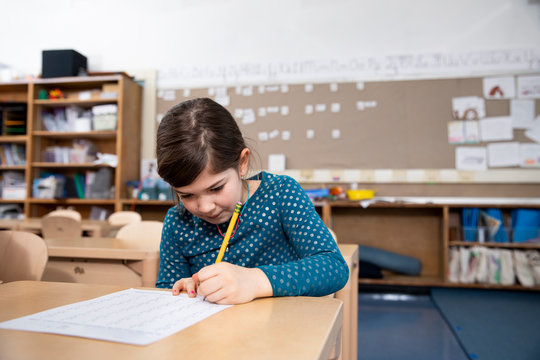 Girl taking test in class