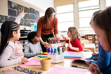 Teacher with art supplies