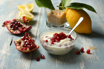 delicious lemon and pomegranate dessert in the glass bowl