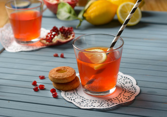 fresh pomegranate drink with lemon slice