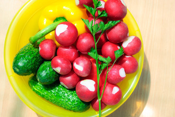 Fresh vegetables in a yellow plate
