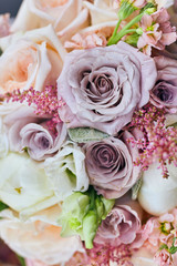 beautiful wedding bouquet with roses standing on the table