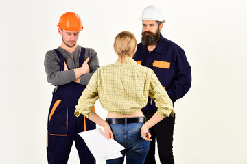 The team to build with. Men and woman builders working in team. Professional people working on...