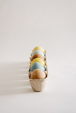 Pastel eggs in cartons
