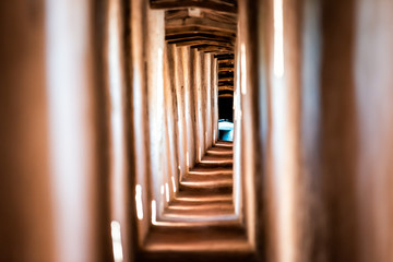 Fortress tunnel path passage in Castiglione del Lago in Italy during summer with windows and shadows contrast in historic town village fort