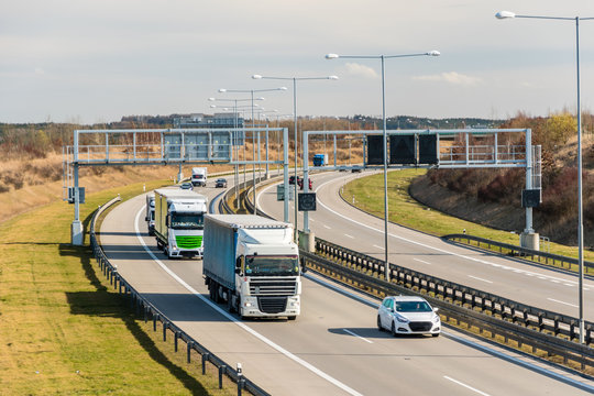 Lorry and car passing toll gate on Prague Circuit, Prague, Czech republic