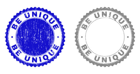 Grunge BE UNIQUE stamp seals isolated on a white background. Rosette seals with distress texture in blue and grey colors. Vector rubber overlay of BE UNIQUE label inside round rosette.