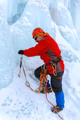 climber with ice ax climbs the glacier