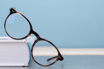 Glasses with book education and knowledge concept picture