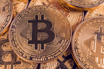 Fototapeta na wymiar Golden Bitcoin coins. New digital and virtual money.