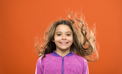 Little cutie. childhood happiness. Family. childrens day. Portrait of happy little child. Kid fashion and sportswear. Happy little girl with long hair. Small girl child. Hairdresser for kids