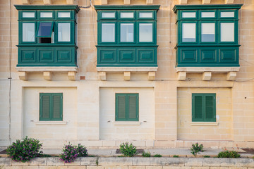 Traditional green balconies. Social housing, Valletta Malta.
