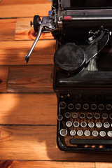 Old typewriter on wood
