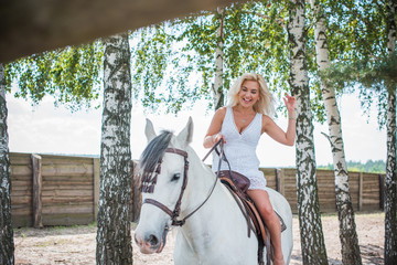Spring - summer season, concept of hobby, Woman with a horse on a nature, relationship human and...