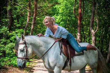 Spring - summer season, concept of hobby, Woman with a horse on a nature, relationship human and...