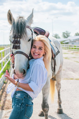 Spring - summer season, concept of hobby, Woman with a horse on a nature, relationship human and...