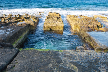 seaside baths carved out of rock on the sliema seafront.