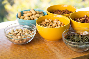 Mixed nuts on wood background 