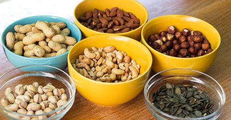 Mixed nuts on wood background 