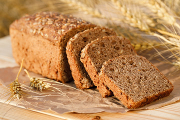 Fresh bread on the table with wheat ears. Food concept