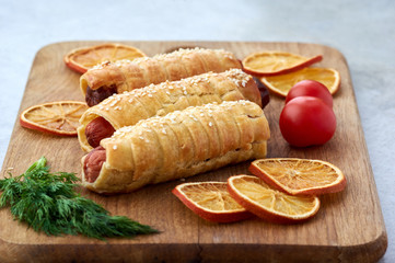 Fried dough enclosed sausages