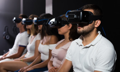 People wearing virtual reality goggles