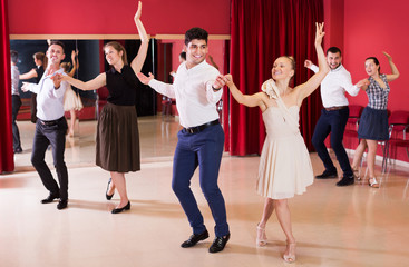 Dancing couples enjoying latin dances