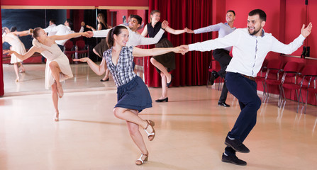 Fototapeta premium Dancing couples enjoying latin dances