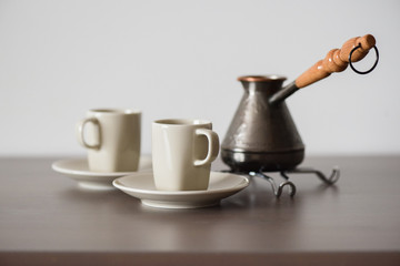 Traditional Turkish coffee brewed in coffee pot minimalist style