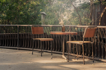 Obraz premium Table, chair without people sitting, concept loneliness, being abandoned