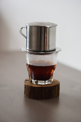 Coffee brewing. Traditional Vietnamese phin filtered coffee minimalist style