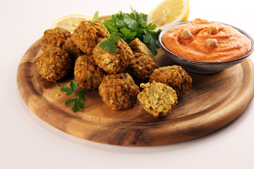 Traditional homemade hummus, falafel and chickpea served with spices on table. Jewish Cuisine.