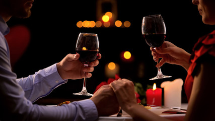 Couple tasting red wine in high-quality restaurant, winemaking traditions, date