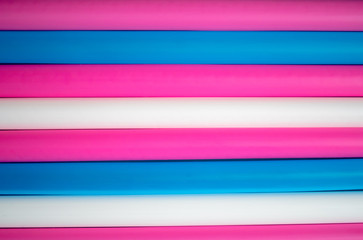 Plastic drinking straws. Close up colorful strip from plastic straws.