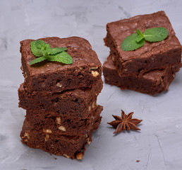 stack of baked square pieces of chocolate brownie pie
