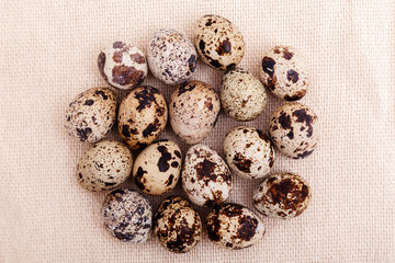 Quail eggs on burlap top view. Easter background. Healthy food, ingredient, Recipe culinary, dietary concept
